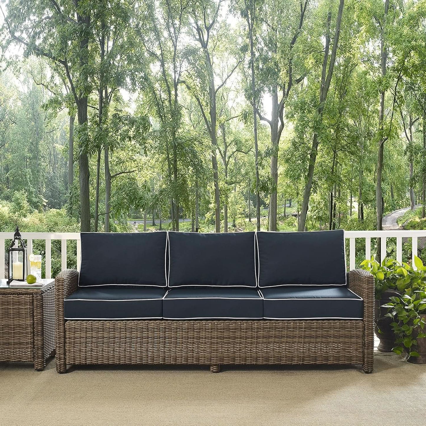 Brown Wicker Outdoor Sofa with Navy Cushions for Comfort