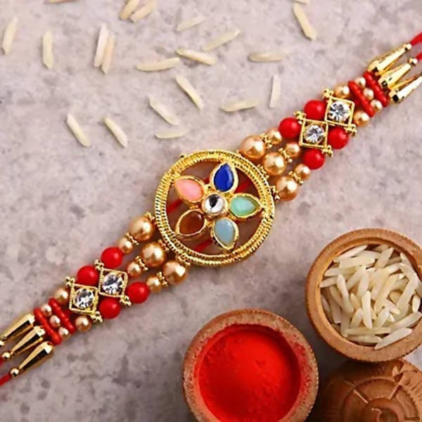Flower Design Kundan Rakhi and Kaju Rolls Box