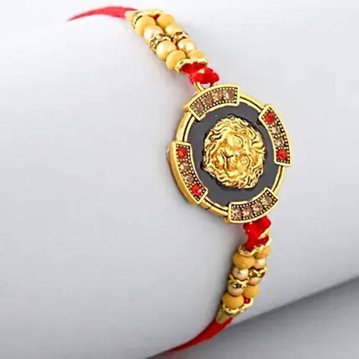 Traditional Lion Face Rakhi & Kaju Roll Box