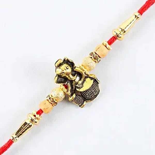 Devotional Lord Ganesha Rakhi & Kaju Roll Box