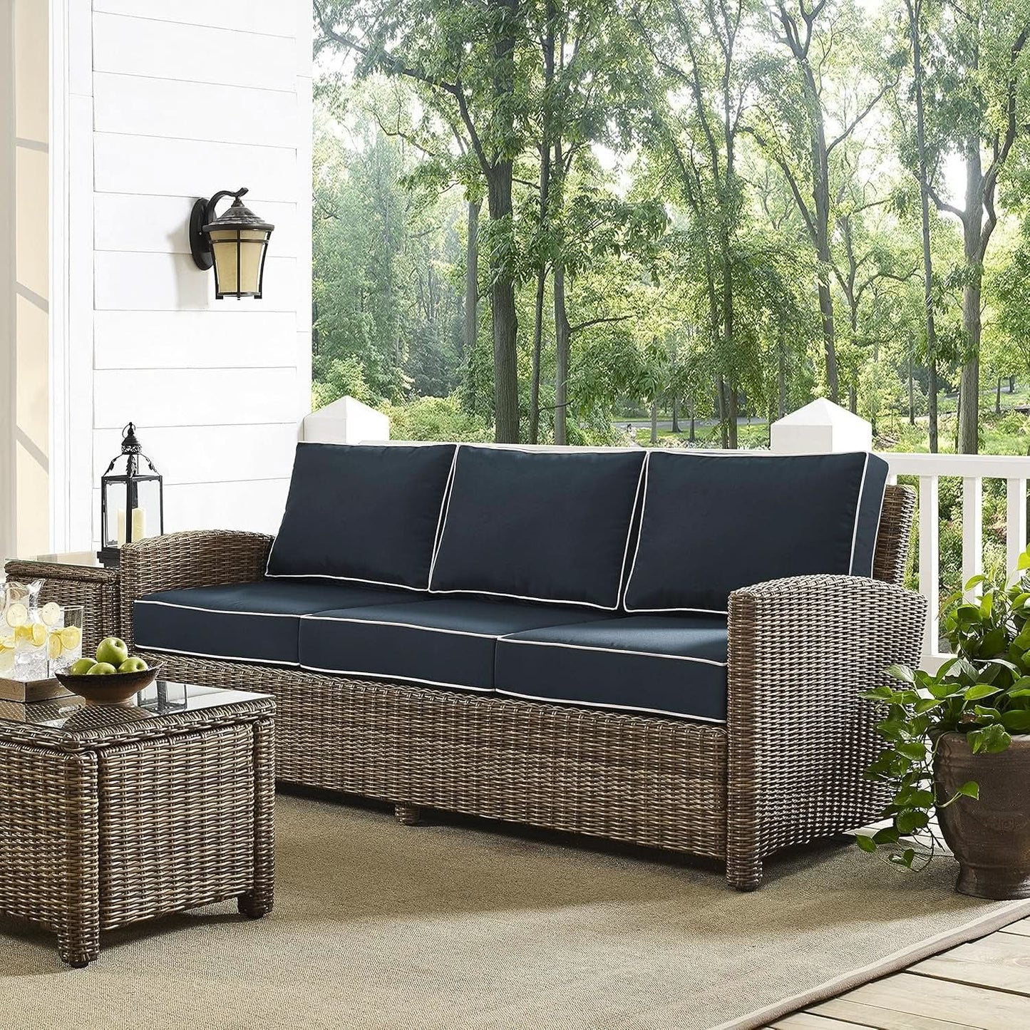 Brown Wicker Outdoor Sofa with Navy Cushions for Comfort